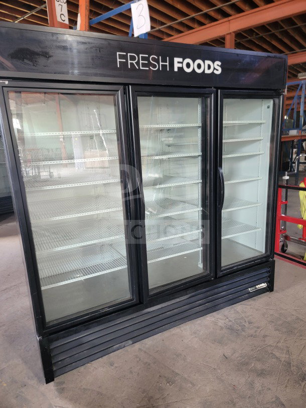 True GDM-72-HC 3-door glass merchandiser refrigerator, commercial-grade, tested and working, ideal for displaying fresh products.