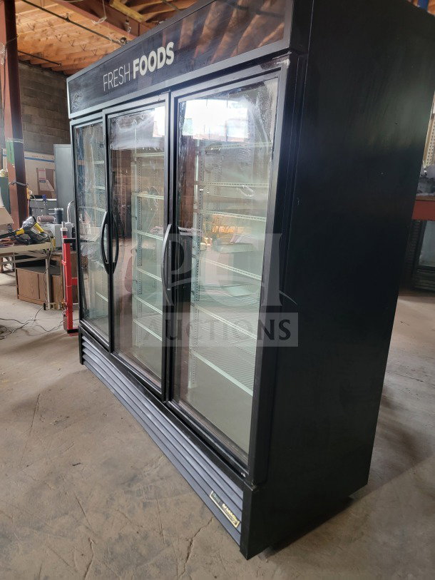 True GDM-72-HC commercial 3-door glass merchandiser refrigerator, tested and working, ideal for display in stores.