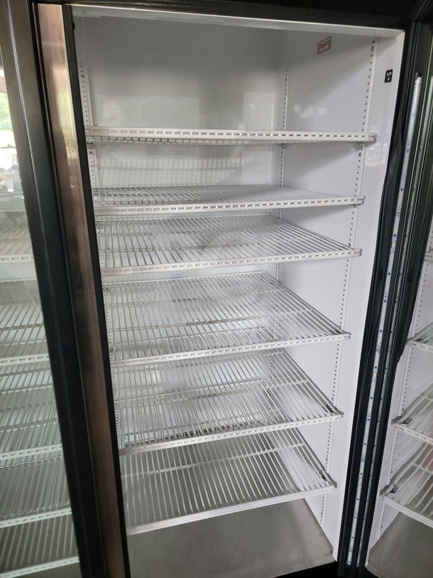 True GDM-72-HC commercial 3-door glass merchandiser refrigerator with adjustable wire shelves, tested and working condition.