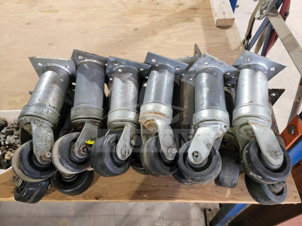 Bulk lot of 15 Middleby Marshall heavy-duty conveyor oven swivel casters, model 22290-0010, shown in used condition.