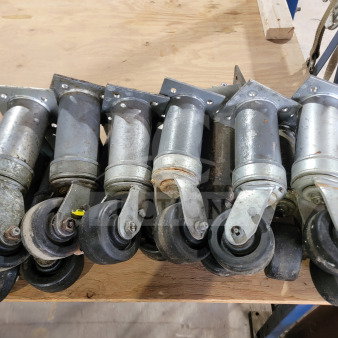 Bulk lot of 15 Middleby Marshall heavy-duty conveyor oven swivel casters, model 22290-0010, shown in used condition.