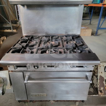 American Range 36" AR-6 6-burner gas range with standard oven, pre-owned, includes bonus ventilation parts. Visible wear, stainless steel.