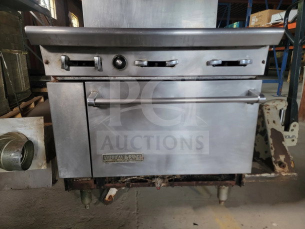 American Range AR-6 36" 6-burner gas range with oven, used condition, includes ventilation parts, ideal for professional kitchens.