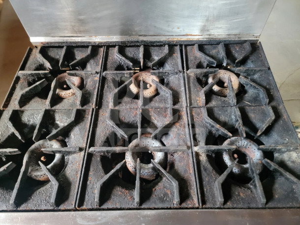 American Range 36" 6-burner gas range, model AR-6, in used condition with visible wear. Includes standard oven.