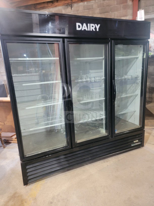 True GDM-72-HC 3-door glass merchandiser refrigerator, black, labeled "Dairy," tested, working, ideal for commercial use.