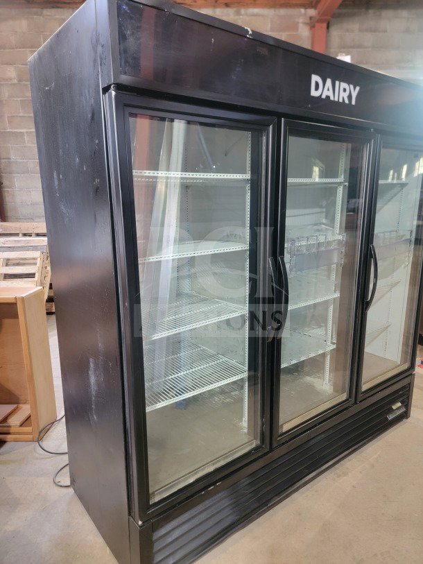 True GDM-72-HC 3-door glass merchandiser refrigerator, black exterior, "DAIRY" label, tested and working condition.