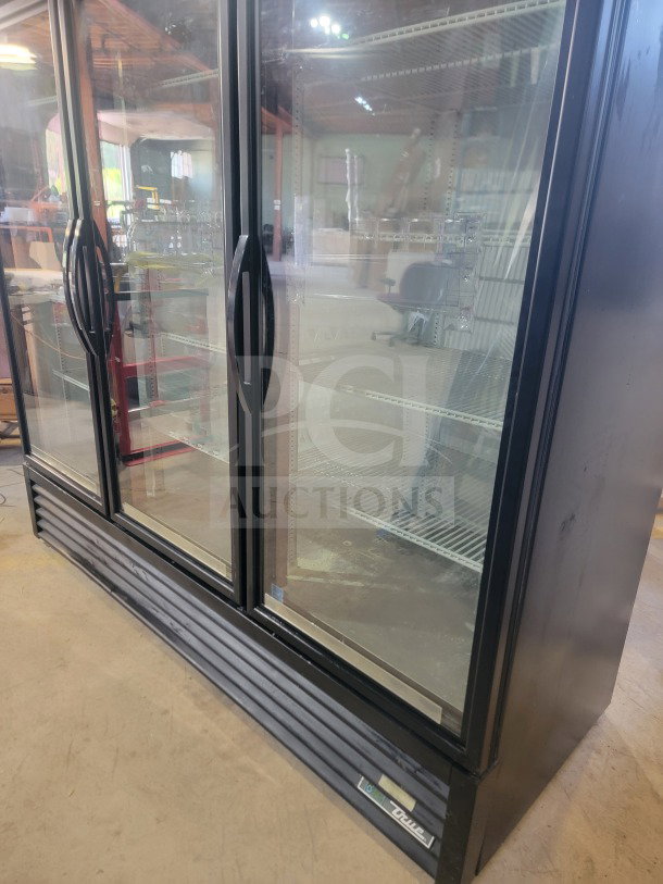 True GDM-72-HC commercial 3-door glass merchandiser refrigerator, tested and working, ideal for retail display.