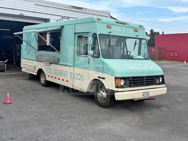 1999 Chevrolet P30 food truck in teal and cream, fully loaded with a commercial kitchen, ready for mobile food business.