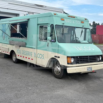 1999 Chevrolet P30 food truck in teal and cream, fully loaded with a commercial kitchen, ready for mobile food business.