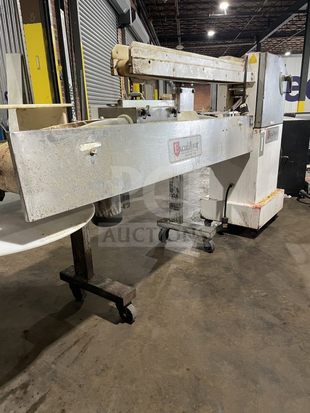 Excalibur S/90 stainless steel bagel divider/former on casters, 220V, floor model; used condition with manufacturer label.