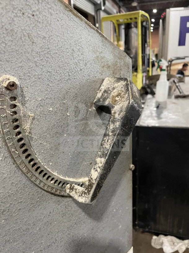 Excalibur S/90 stainless steel bagel divider with visible rust and wear, floor model on casters, 220V operation.