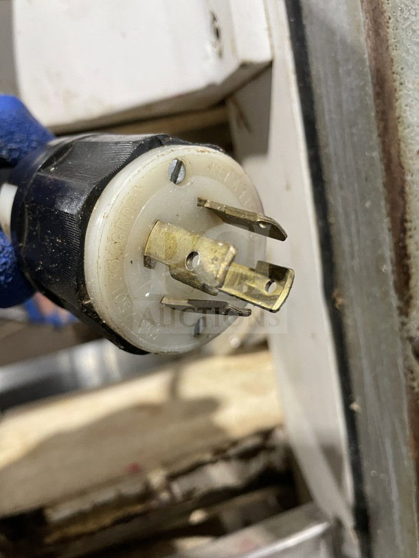 Close-up of a heavy-duty 220V electrical plug for Excalibur Model S/90 Bagel Divider/ Former.