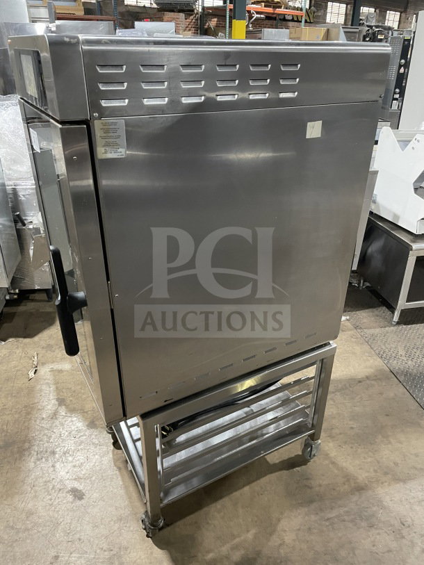 Alto Shaam 2021 electric half-size multi-cook oven, model VMC-H4H, with 4 zones. Stainless steel on a storage shelf with casters.