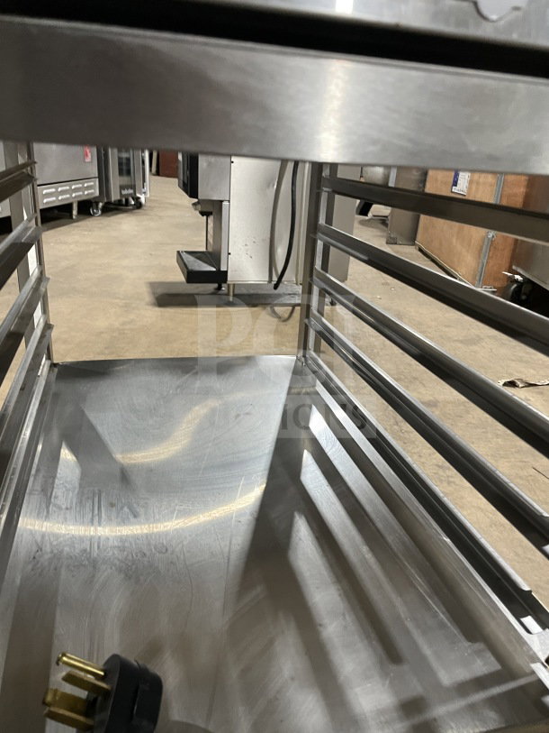 Alto Shaam VMC-H4H multi-cook oven, stainless steel, 4 chamber zones, 5 pan rack, on casters, 208-240V, 3 phase.