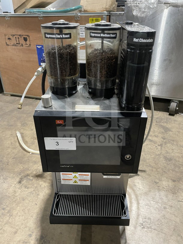 Melitta Cafina CT8-2G-2TF-WO-0-1/S-T S0256 super-automatic espresso machine, stainless steel, 208V, 2 phase, with labeled bean and chocolate containers.