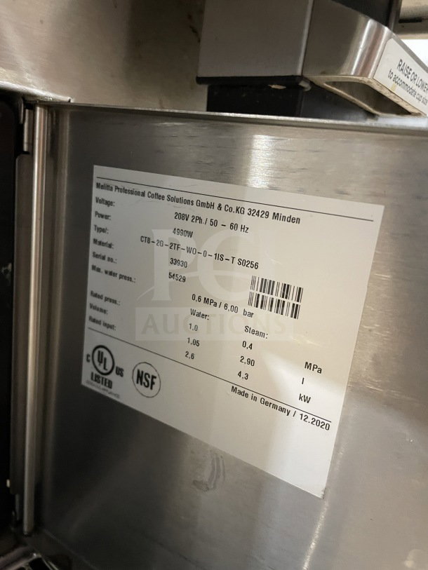 Melitta Cafina Series CT82G2TFWO01/ST stainless steel espresso machine, features visible 208V, 2 Phase, model label.