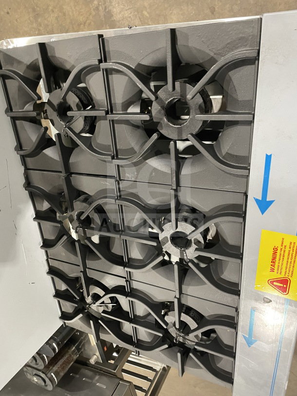 Brand new Kutano 36" stainless steel 6-burner range, model KUT6BRN36NG. Features natural gas, standard oven, chrome rack.
