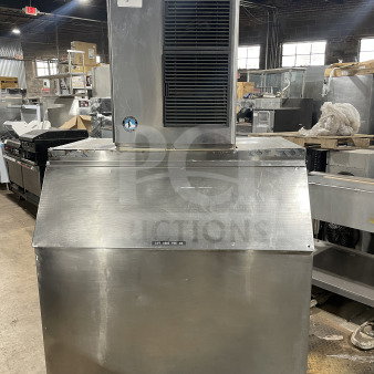 Hoshizaki KM-515MAH commercial ice machine, stainless steel, air-cooled, on legs, visible serial number B04669A, robust condition.