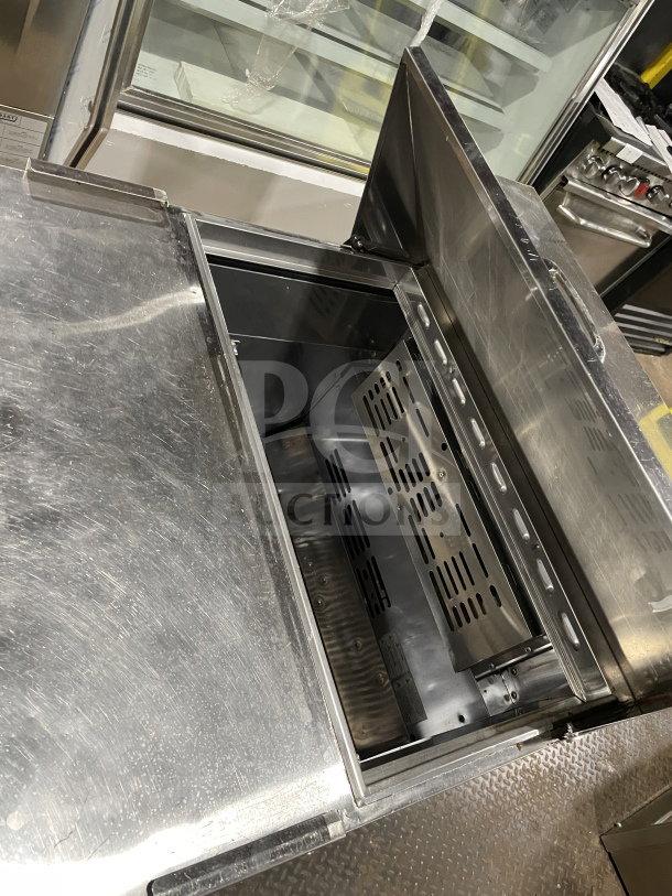 Turbo Air TST-28SD-D2-N stainless steel prep table, 2-drawer, refrigerated, on casters, model label visible, used.