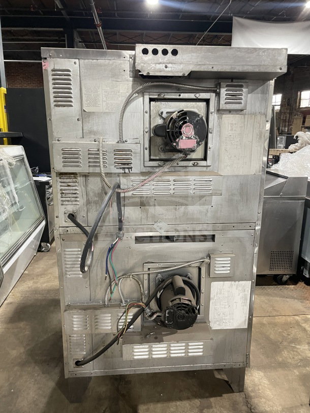 SunFire commercial stainless steel double-stacked convection oven, model ICO E 10M, 208V, 3-phase, on legs, with wired rack.