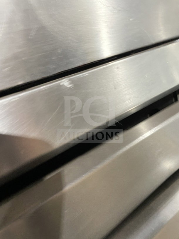 SunFire commercial stainless steel electric double-stacked convection oven, model ICO E 10M, features wired rack, on legs.