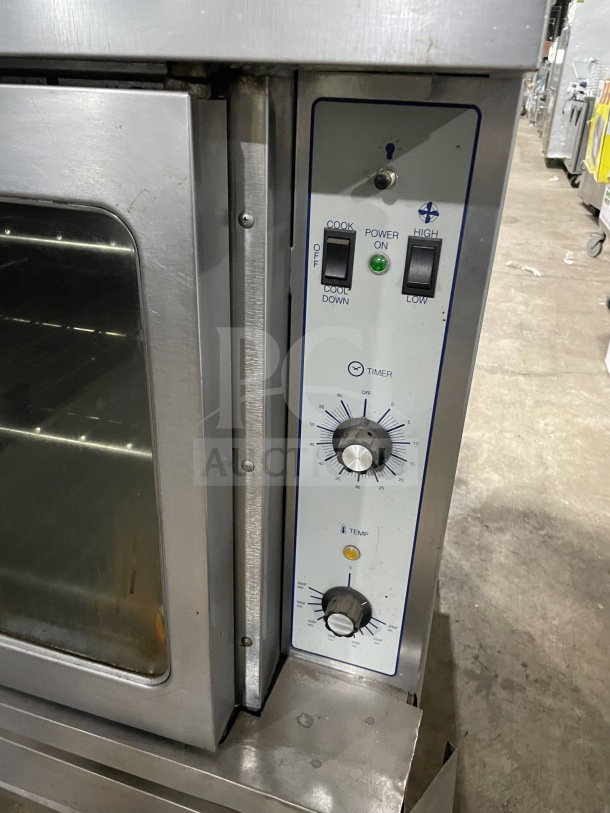 SunFire stainless steel double stacked convection oven, Model ICO E 10M, 208V 3 Phase, with wired oven rack, on legs.