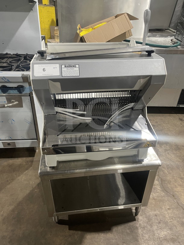 JAC MJL 450/13 electric bread slicer with stainless steel cart, serial 17103997, in good condition, on casters, 120V 1-phase.