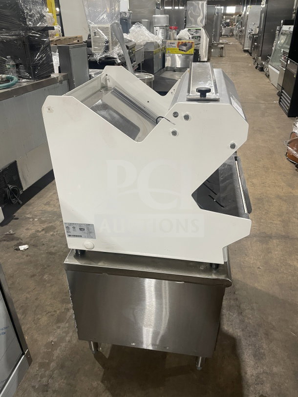 JAC MJL 450/13 electric bread slicer on stainless steel utility cart, 120V, used condition, on casters, serial number 17103997.