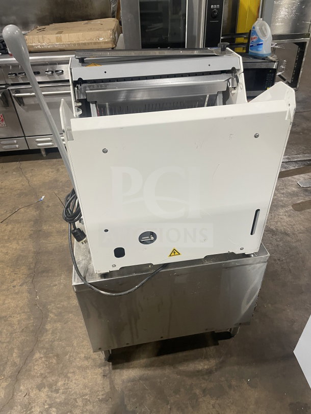 JAC MJL 450/13 electric bread slicer with automatic feed, on stainless steel cart with casters, serial 17103997, 120V, 1 phase.
