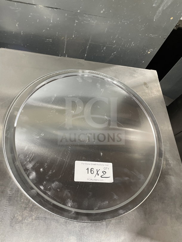 Thunder Group stainless steel pizza tray, model ALPTWR018, unused condition, with quantity label "16X2" visible.