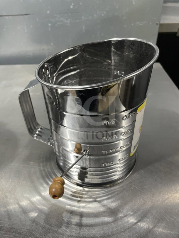 Mrs. Anderson's Commercial Stainless Steel Baking Flour Sifter, Model 28015, hand-crank, new condition, with measurement markings.