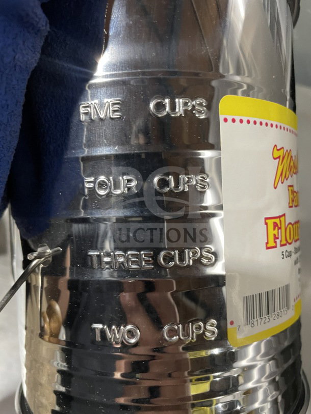 Mrs. Anderson’s stainless steel flour sifter, Model 28015, shows cup measurements. New condition, includes label and barcode.