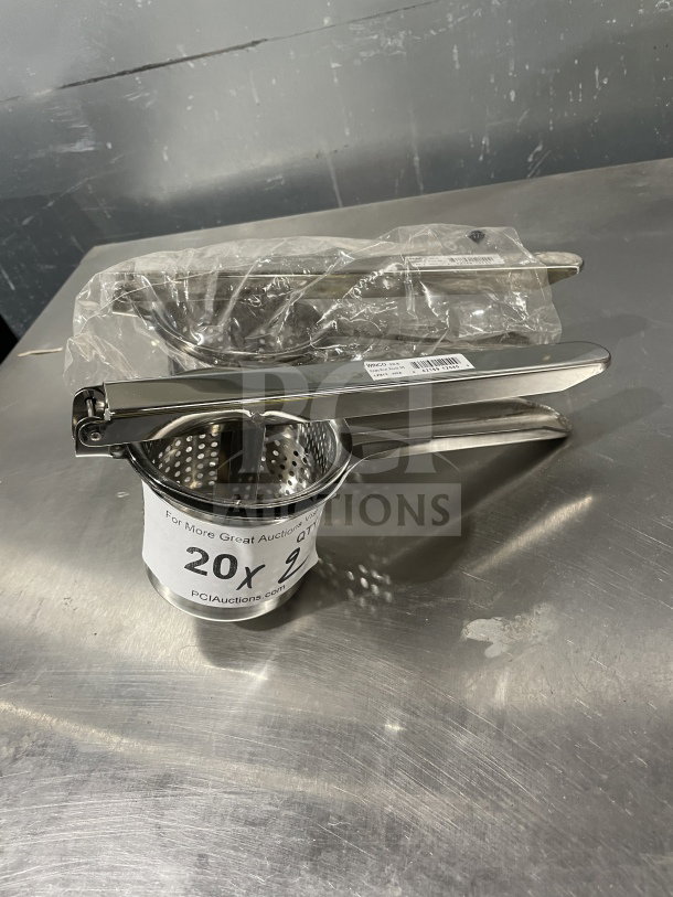 Winco PR9 stainless steel potato ricer, new condition, with perforated round bowl, label indicating model and SN: 842169120409.