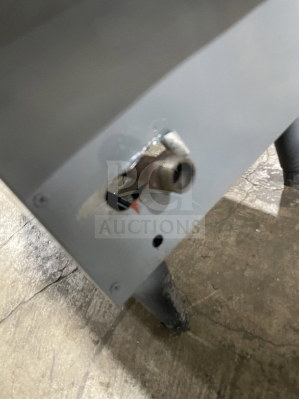 Cecilware commercial stainless steel gas-powered fat fryer showing close-up of connection port and sturdy leg support.