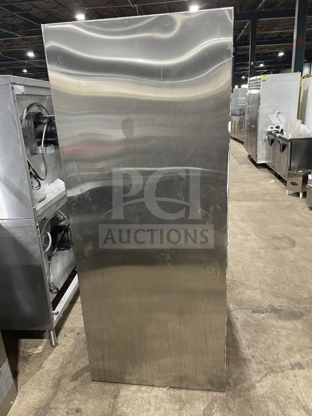 Traulsen stainless steel refrigerator, model RHT232NUTSL-012, with double glass sliding doors and chrome rack. 115V, 1 phase.