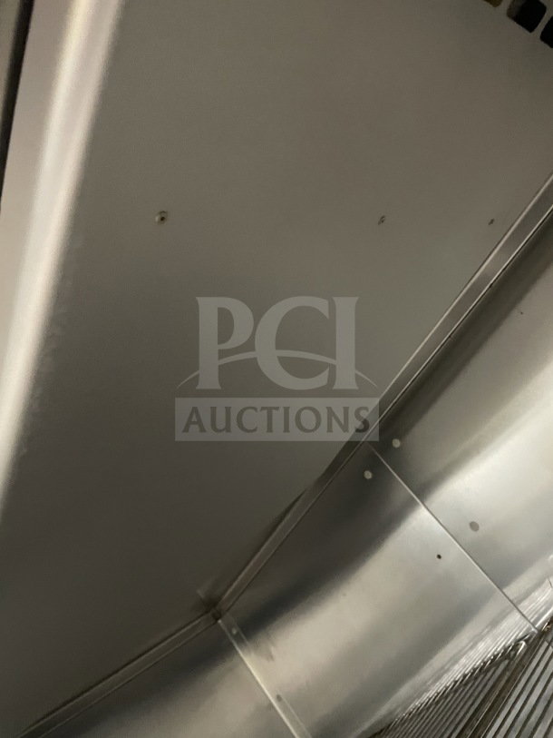 Traulsen commercial stainless steel refrigerator, model RHT232NUTSL012, sliding glass doors, chrome rack, excellent condition.