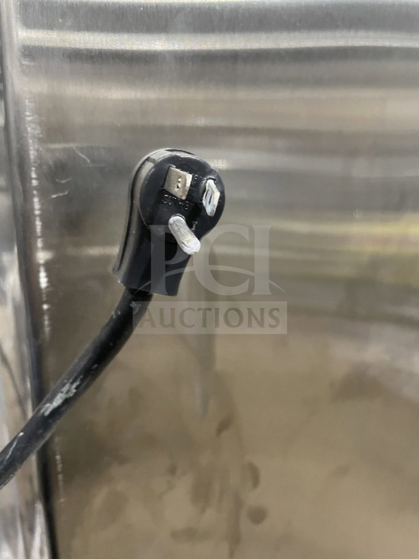 Close-up of a power plug for a Traulsen commercial stainless steel refrigerator, Model RHT232NUTSL012.