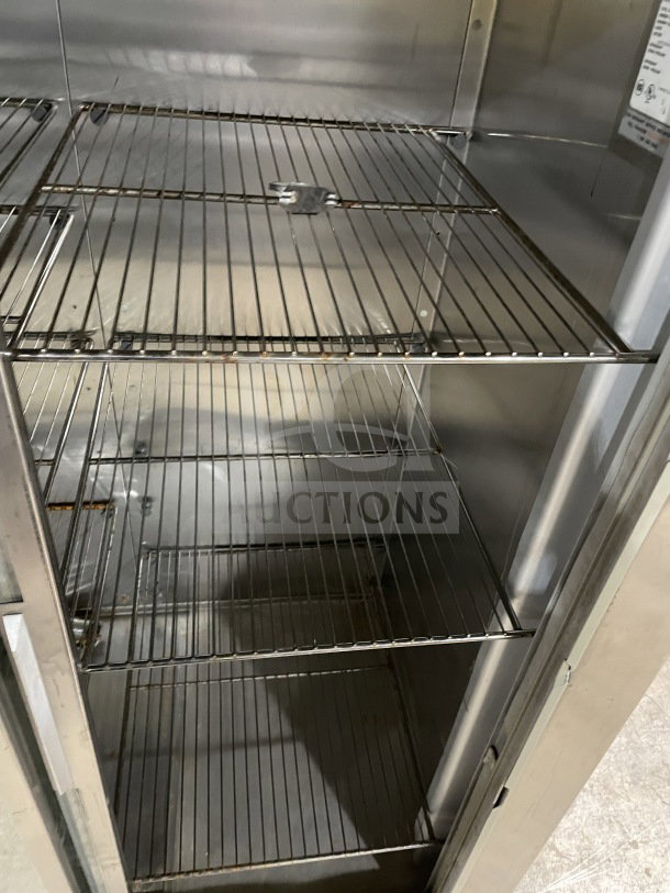 Traulsen commercial stainless steel double glass sliding door reach-in refrigerator with chrome plated wired rack, model RHT232NUTSL012.