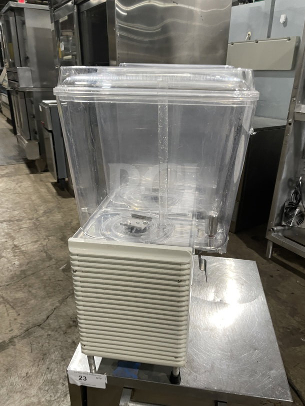 Crathco D354 countertop beverage machine with 3 hoppers, stainless steel base, model D354, SN:30821072591, 115V, on legs.