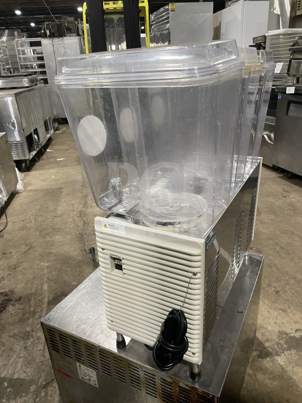 Crathco D354 3 Hopper Beverage Machine on stainless steel base, 115V, model D354, SN:30821072591, on legs, used condition.