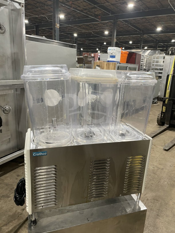 Crathco D354 commercial countertop beverage machine with 3 hoppers, stainless steel base, model D354, 115V, on legs.