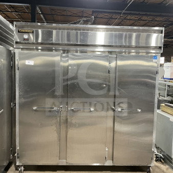 Continental 3F 3-door stainless steel reach-in freezer, Energy Star certified, with poly coated rack, on casters, model SN: 15127134.