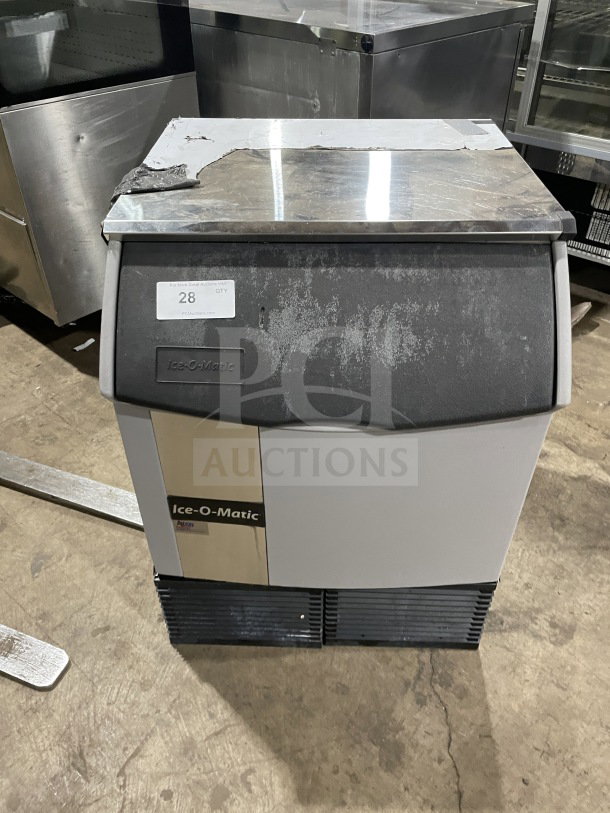 Ice-O-Matic commercial under-counter ice machine, 115V, 1 phase, used condition, visible surface wear, Ice-O-Matic logo on front.