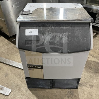 Ice-O-Matic commercial under-counter ice machine, 115V, 1 phase, used condition, visible surface wear, Ice-O-Matic logo on front.