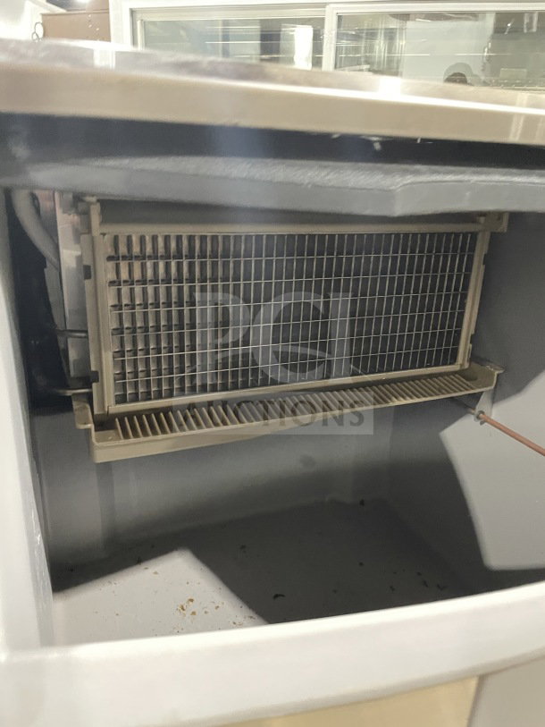 Ice-O-Matic commercial under-counter ice machine, 115V, 1 Phase, internal view of ice-making components.