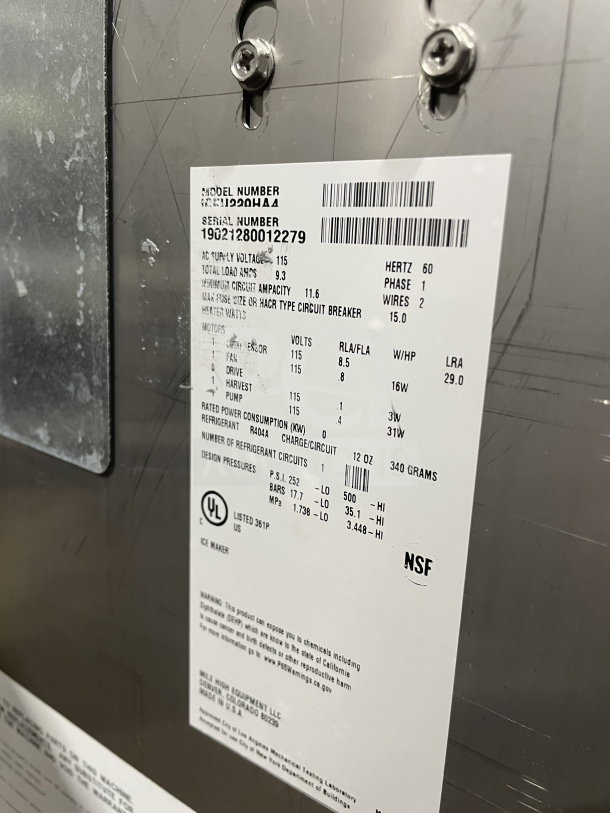 IceOMatic commercial under-counter ice machine with model and serial number tags. Features 115V, 1 phase, NSF certified.