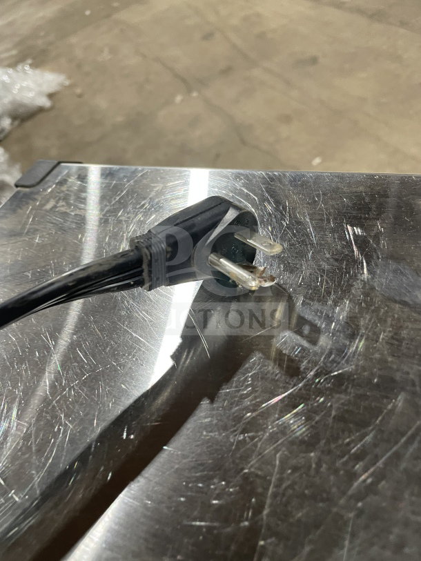 Ice-O-Matic commercial under-counter ice machine, 115V, 1 phase. Stainless steel exterior with plug shown, good condition.