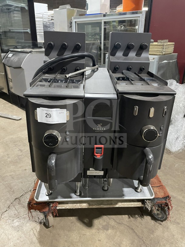 Clover CM9700 Vertica Series commercial coffee brewer, 6 flavor hoppers, on legs, 208V, serial E311353, used condition.