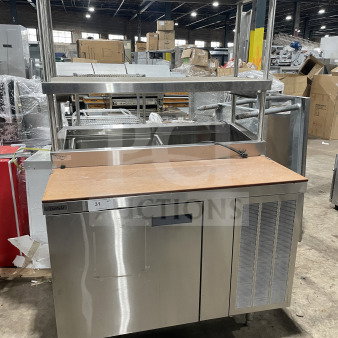 Delfield stainless steel pizza prep table with refrigerated base, double overhead shelf, chrome rack, and legs, 115V.