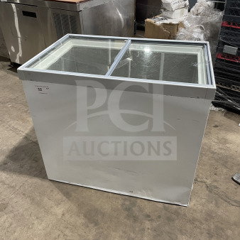 Commercial white curved glass 46" ice cream dipping cabinet. Rear lift-open access. Slight wear, ideal for retail settings.